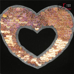 toppa in paillettes a forma di cuore rosa